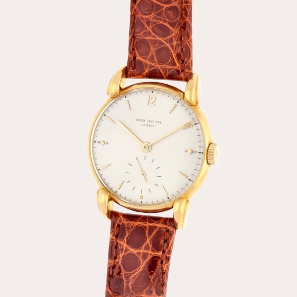 Patek Philippe Reference 1590 | A yellow gold wristwatch with teardrop lugs | Made in 1949 · 1590