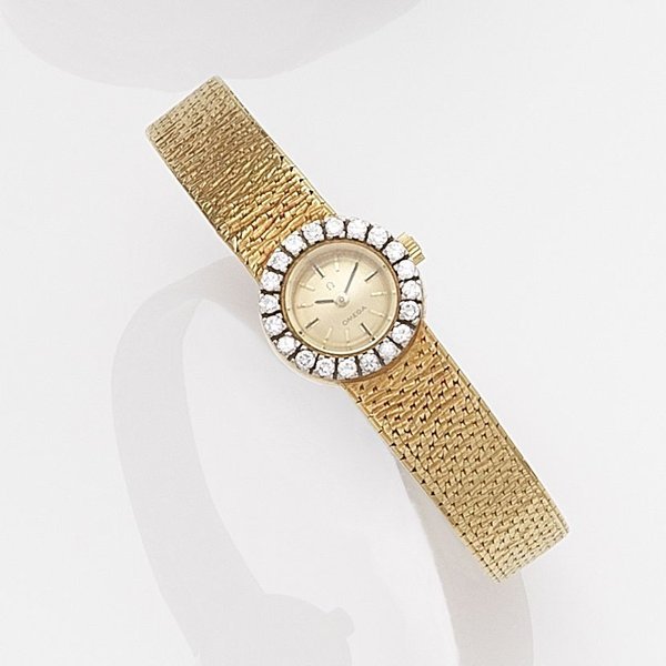 Omega Omega. A lady's 18k gold diamond set manual wind bracelet watch Case No.8115716, Movement No.91576511, London Hallmark for 1963