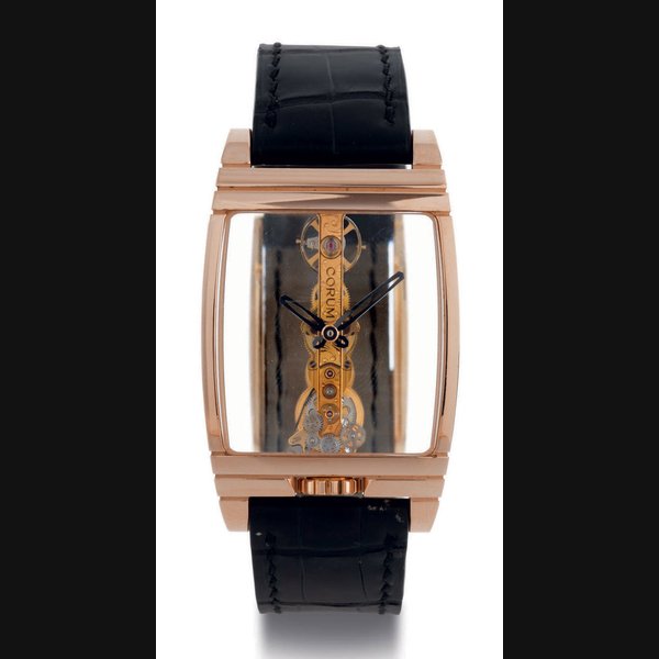 CORUM. A FINE AND LARGE LIMITED EDITION CURVED TONNEAU SKELETONIZED WRISTWATCH SIGNED CORUM, GOLDEN BRIDGE, CASE NO. 1410208, REF. 113.550.55, MANUFACTURED IN 2005