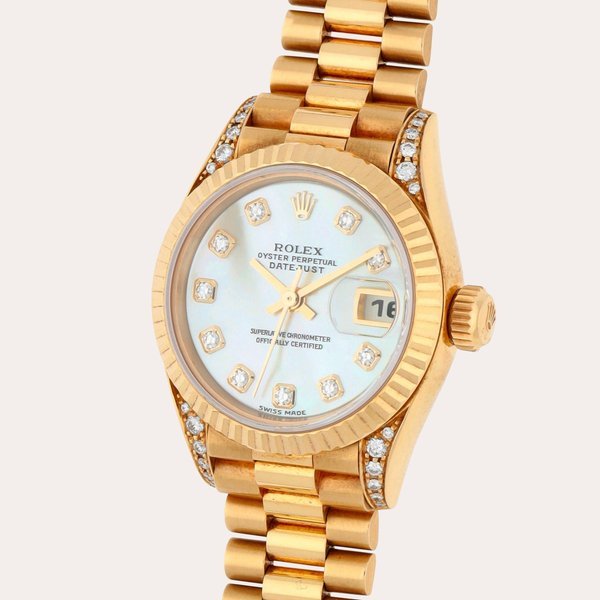 Rolex Datejust, Reference 79238 | A yellow gold and diamond-set wristwatch with date, bracelet and mother-of-pearl dial | Circa 1999 · 79238