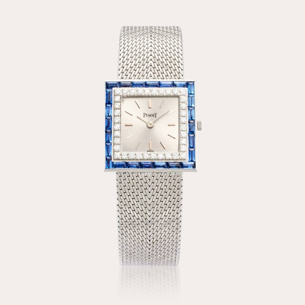 Piaget Reference 9203 B91 | Retailed by Van Cleef & Arpels: A white gold, sapphire and diamond-set square shaped bracelet watch, Circa 1975