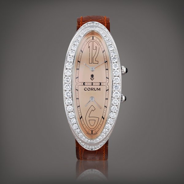 Corum Lady's Millennium 2000, limited edition, reference 137.310.69    Montre bracelet en or blanc et sertie de diamants avec double fuseau horaire |  White gold and dimond-set wristwatch with dual time zone     Vers 2000 |  Circa 2000