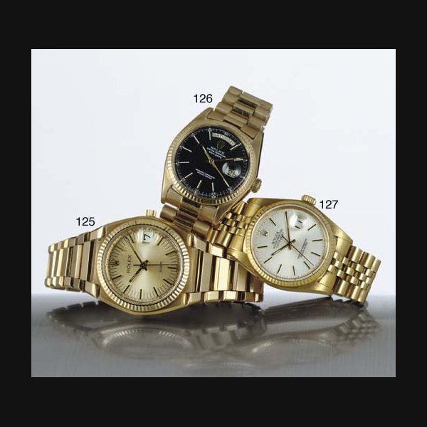 Rolex ROLEX. AN 18K GOLD AUTOMATIC WRISTWATCH WITH CENTER SECONDS, DAY, DATE AND BRACELET SIGNED ROLEX, OYSTER PERPETUAL, DAY-DATE, CASE NO. 3353903, REF. 1803, CIRCA 1972, Price & Market Data