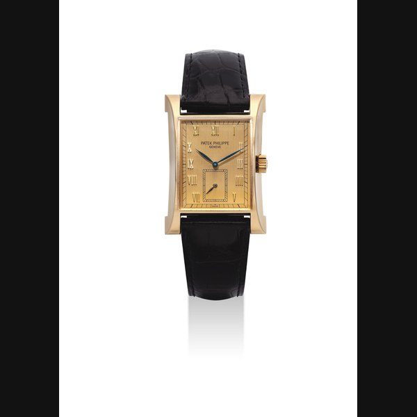 PATEK PHILIPPE. A FINE 18K GOLD LIMITED EDITION RECTANGULAR WRISTWATCH WITH ORIGINAL CERTIFICATE AND BOX, MADE TO COMMEMORATE THE OPENING OF PATEK PHILIPPE'S WATCHMAKING CENTRE IN GENEVA IN 1997 SIGNED PATEK PHILIPPE, GENEVE, PAGODA MODEL, REF. 5500, MOVEMENT NO. 1'859'006, CASE NO. 4'013'927, CIRCA 1997