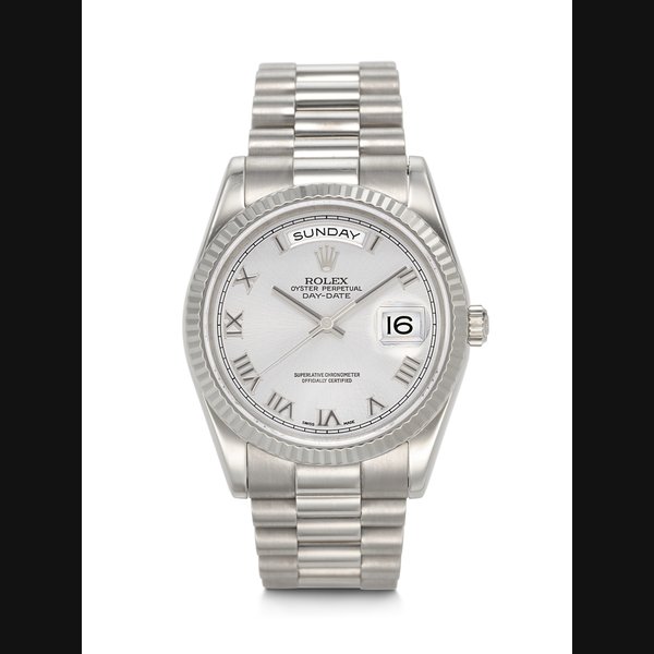 ROLEX. A DESIRABLE AND ATTACTIVE 18K WHITE GOLD AUTOMATIC WRISTWATCH WITH SWEEP CENTER SECONDS, DAY, DATE, AND BRACELET DAY-DATE MODEL, REF. 118239, CASE NO. F122985, CIRCA 2004