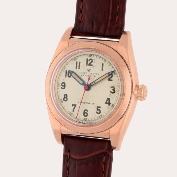 Rolex Oyster Perpetual, Reference 3696 | A pink gold and stainless steel wristwatch | Circa 1945