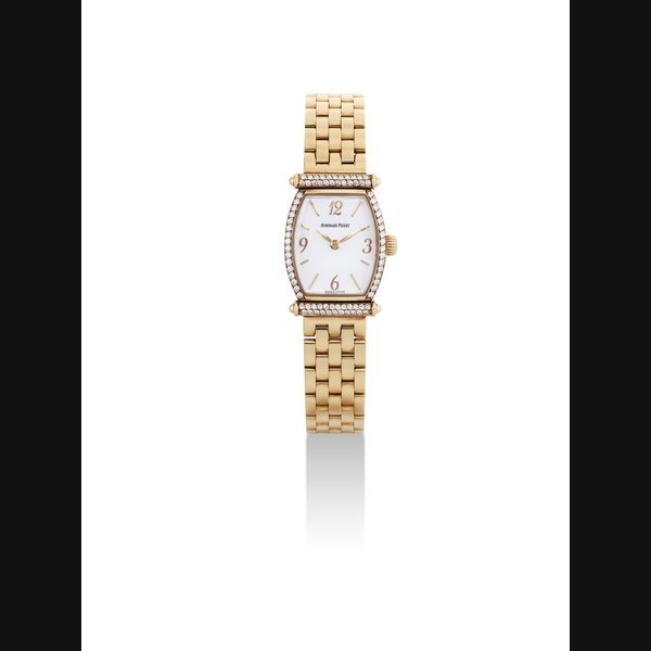 Audemars Piguet AUDEMARS PIGUET. A LADY'S 18K GOLD AND DIAMOND-SET TONNEAU-SHAPED WRISTWATCH WITH BRACELET SIGNED AUDEMARS PIGUET, CARNEGIE MODEL, CASE NO. 69'663, CIRCA 1996