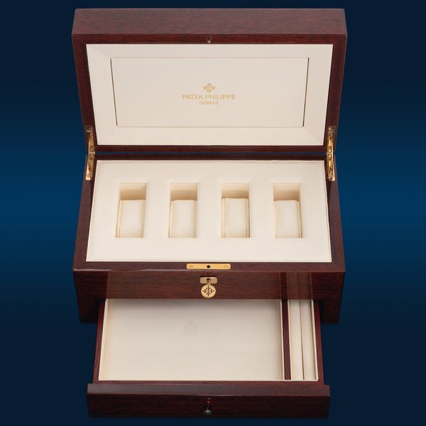 Patek Philippe Patek Philippe A rare and well-preserved wooden presentation box with four compartments