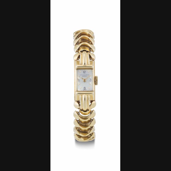 Patek Philippe. A Lady's 18k Gold Bracelet Watch SIGNED PATEK PHILIPPE CO., GENEVE, REF. 2137, MOVEMENT NO. 843'082, CASE NO. 510'646, MANUFACTURED IN 1949