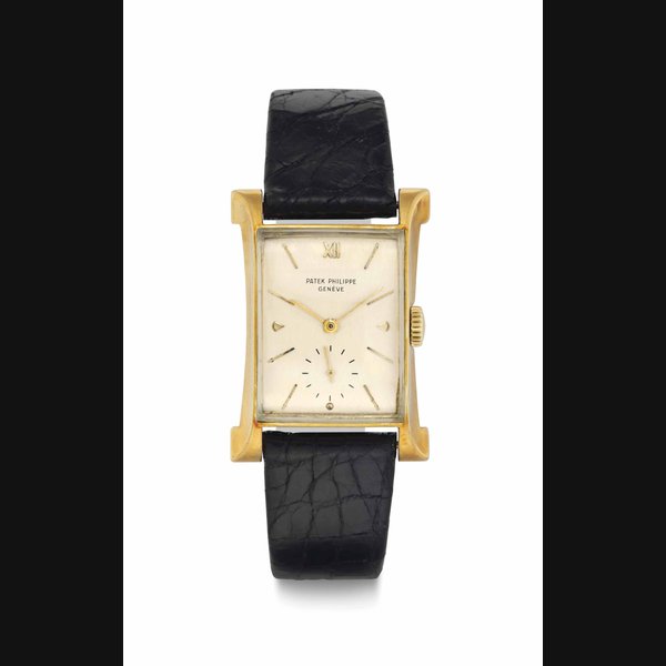 Patek Philippe. A Rare 18k Gold Rectangular-Shaped Wristwatch with Flared Sides SIGNED PATEK PHILIPPE, GENEVE, REF. 2441, MOVEMENT NO. 970'910, CASE NO. 653'876, MANUFACTURED IN 1948