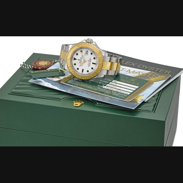 ROLEX. A FINE 18K GOLD AND STAINLESS STEEL AUTOMATIC WRISTWATCH WITH DATE, BRACELET, ORIGINAL GUARANTEE AND BOX SIGNED ROLEX, OYSTER PERPETUAL DATE, YACHT-MASTER, REF. 16623, CASE NO. Z557977, CIRCA 2007