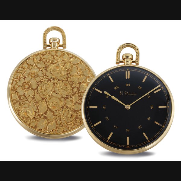 E. GÜBELIN. A FINE OVERSIZE 18K GOLD OPENFACE KEYLESS LEVER DRESS WATCH WITH BLACK DIAL AND 24 HOURS SIGNED E. GÜBELIN, MOVEMENT NO. 80060, CASE NO. 96783, CIRCA 1960
