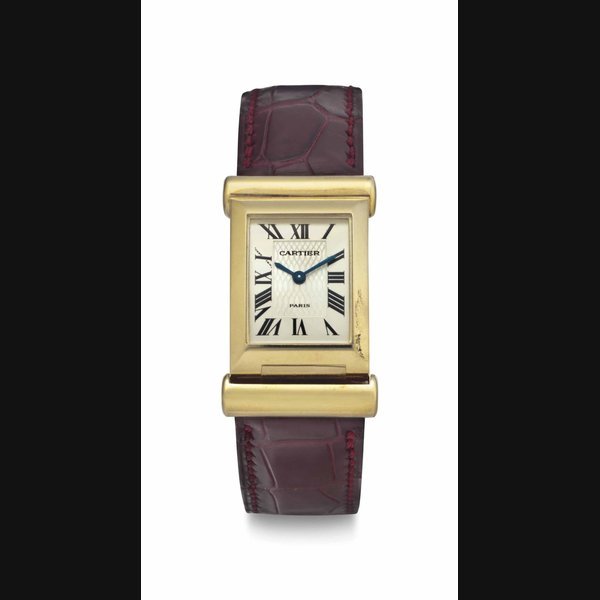 Cartier Cartier. A Limited Edition Lady's 18k Gold Rectangular Curved Back Wind Wristwatch SIGNED CARTIER, PARIS, NO. 117/150, CIRCA 1997