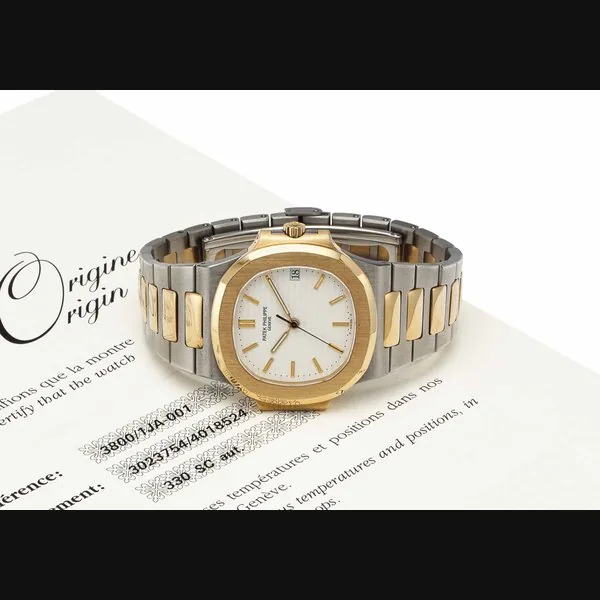 Patek Philippe. An 18k Gold and Stainless Steel Automatic Wristwatch with Date and Bracelet SIGNED PATEK PHILIPPE, GENEVE, NAUTILIUS MODEL, REF. 3800/1JA-001, MOVEMENT NO. 3'023'754, CASE NO. 4'018'524, MANUFACTURED IN 1997