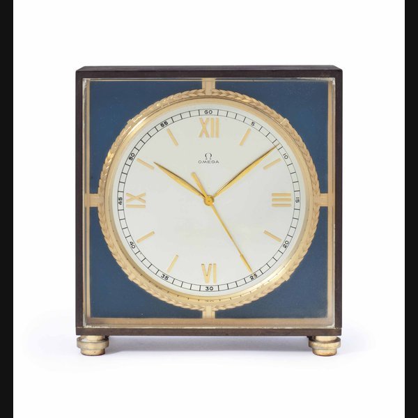 Omega Omega. A Brass Eight Day Desk Clock with Center Seconds and Original Presentation Box SIGNED OMEGA, MOVEMENT NO. 9'890'500, CIRCA 1950