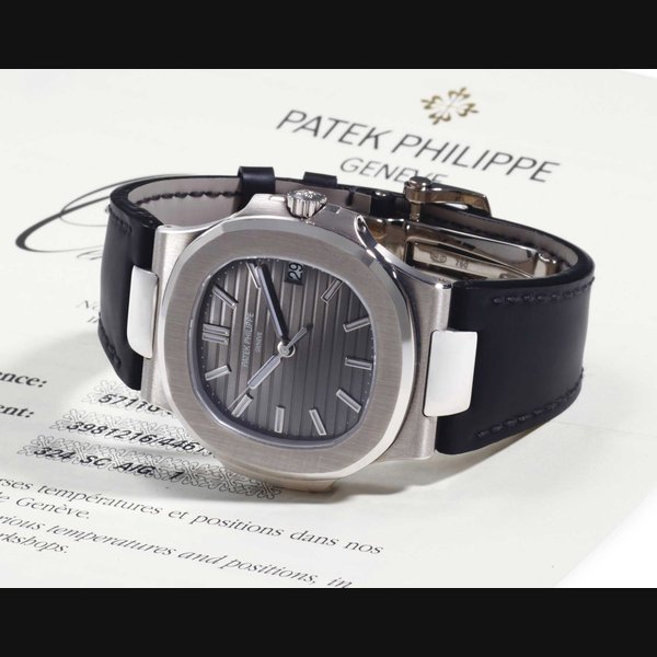 Patek Philippe. An 18k White Gold Automatic Wristwatch With Date, Center Seconds And Original Certifcate SIGNED PATEK PHILIPPE, GENEVE, RETAILED BY WEMPE, MADRID, NAUTILUS MODEL, REF. 5711, MOVEMENT NO. 3'981'216, CASE NO. 4'461'154, CIRCA 2009