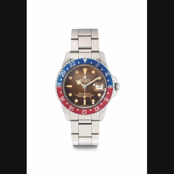 Rolex Rolex. A Fine and Rare Stainless Steel Automatic Dual Time Wristwatch with Date, Center Seconds, Pointed Crown Guard, Tropical Dial and Bracelet Signed Rolex, Oyster Perpetual, GMT-Master, Ref. 1675, Case No. 503’740, Manufactured in 1961 · 1675
