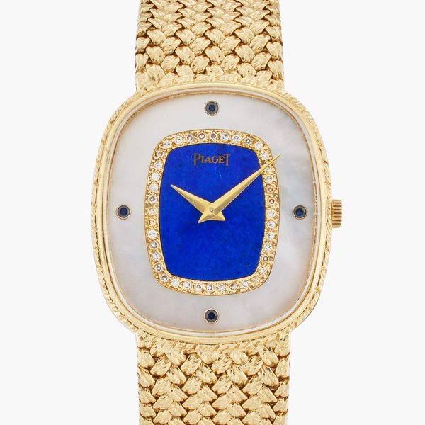 Piaget Reference 94438 D4 | A yellow gold bracelet watch with lapis lazuli, mother-of-pearl and sapphire and diamond-set dial, Circa 1980