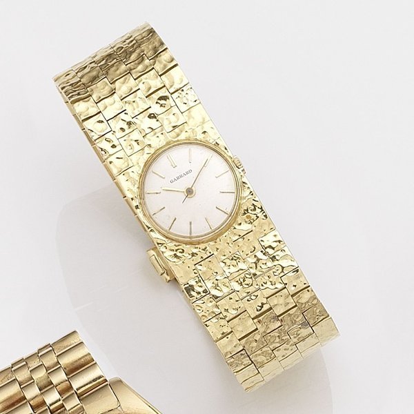 Garrard Swiss. A lady's 18k gold manual wind bracelet watch Retailed by Garrard, Case No.139649, Circa 1960