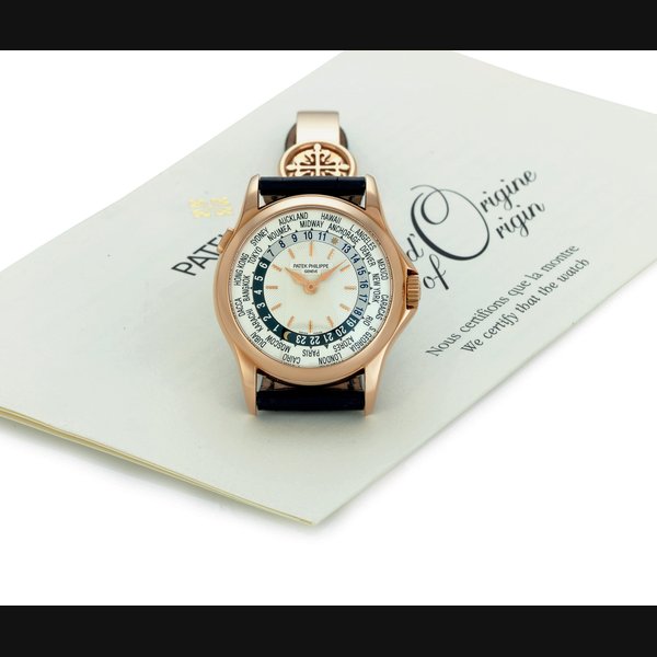 PATEK PHILIPPE. A FINE 18K PINK GOLD AUTOMATIC WORLD TIME WRISTWATCH SIGNED PATEK PHILIPPE, GENEVE, MOVEMENT NO. 3210447, CASE NO. 4181608, REF. 5110, MANUFACTURED IN 2003