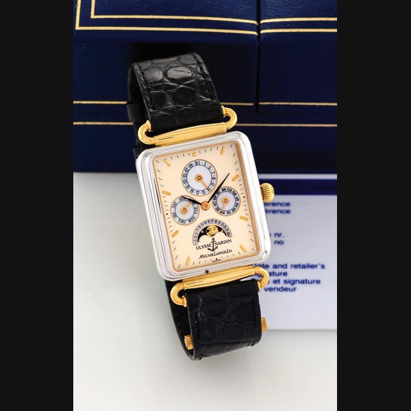 Ulysse Nardin ULYSSE NARDIN - MICHELANGELO BICOLOR GOLD Ulysse Nardin, "Michelangelo Calendar Moonphase", No. 1583, Ref. 331-42. Made circa 1990. Very fine, rectangular, water-resistant, 18K white and yellow gold wristwatch with triple-date calendar, moon phases and a gold-plated Ulysse Nardin buckle. Accompanied by an Ulysse Nardin box and certificate. | Important Modern & Vintage Timepieces | Geneve, 11 May 2014 · 331-42