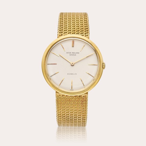 Patek Philippe Reference 2591 Calatrava | Retailed by Gübelin: A yellow gold wristwatch with bracelet, Circa 1961
