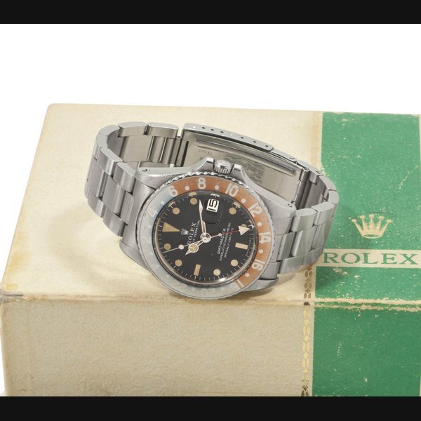 Rolex Rolex. A Fine and Rare Stainless Steel Automatic Dual Time Wristwatch with Center Seconds, Date, Original Guarantee and Box SIGNED ROLEX, OYSTER PERPETUAL, GMT-MASTER, REF. 1675, CASE NO. 2'145'100, CIRCA 1968 · 1675