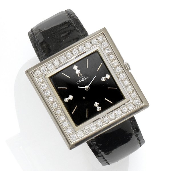 Cartier Omega. A 14K white gold and diamond set manual wind wristwatch Ref:D6650, Case No.778620, Movement No.33419623, Circa 1980