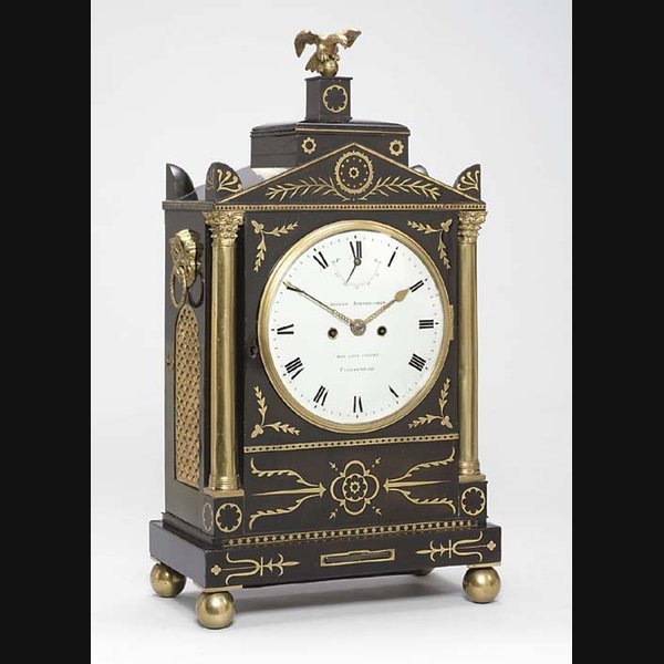 An Unusual Regency Ebonised An unusual Regency ebonised, brass-mounted and inlaid striking table clock with regulation to the dial JOSIAH BARTHOLOMEW, LONDON. CIRCA 1813