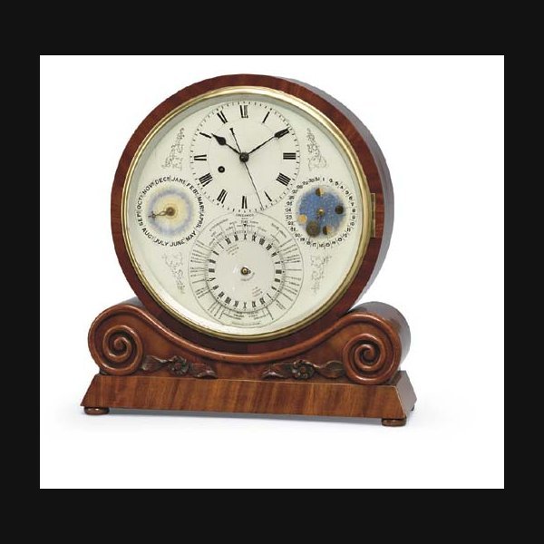 An unusual Victorian carved mahogany mantel clock with world time, calendar and moonphase CIRCA 1860