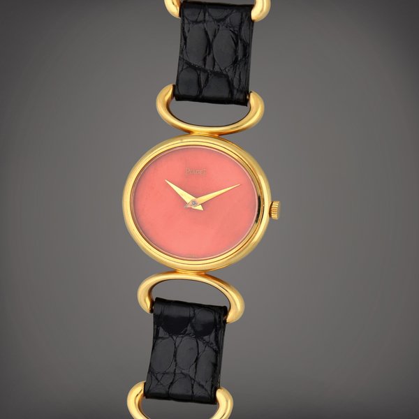 Piaget Reference 9802 D | A yellow gold bracelet watch with coral dial | Circa 1970