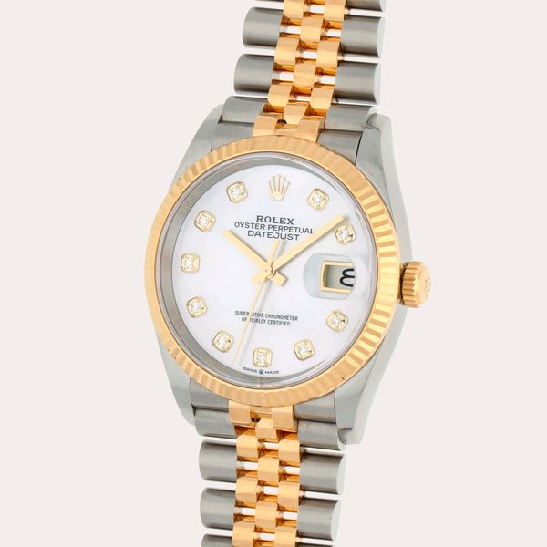 Rolex Datejust, Reference 126233 | A stainless steel and yellow gold wristwatch with date, bracelet and diamond-set mother-of-pearl dial | Circa 2019