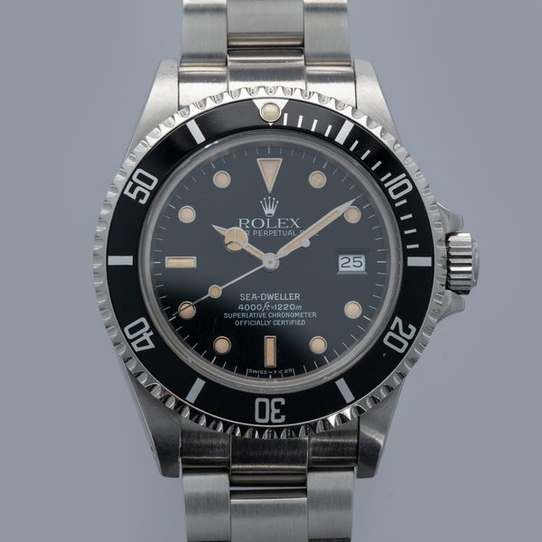 Rolex Rolex Sea-Dweller	16660 Box and Papers · 16660