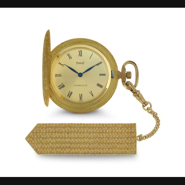 Piaget. An 18k Gold Hunter Case Keyless Lever Dress Watch With Fob SIGNED PIAGET, RETAILED BY TIFFANY & CO., CIRCA 1965