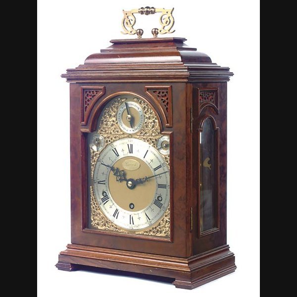 An English walnut and brass-mounted month-going and quarter-chiming bracket clock, on wall bracket, circa 1979