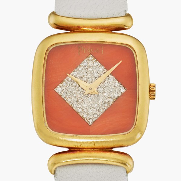 Piaget Reference 9902 D | A yellow gold cushion-shaped watch with coral and diamond-set dial, Circa 1976