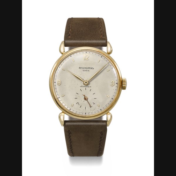 PATEK PHILIPPE. A VERY RARE AND ATTRACTIVE 18K GOLD WRISTWATCH WITH TWO-TONE DIAL AND FANCY LUGS RETAILED BY HAUSMANN & CO., REF. 1503, MOVEMENT NO. 929'665, CASE NO. 629'069, MANUFACTURED IN 1946