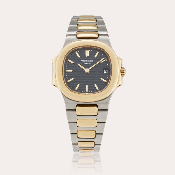 Patek Philippe Reference 4700/11 Nautilus | A stainless steel and yellow gold wristwatch with date and bracelet, Made in 1987