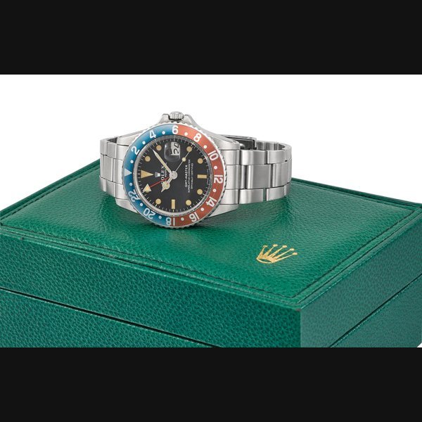 Rolex ROLEX. A VERY RARE AND ATTRACTIV STAINLESS STEEL DUAL TIME AUTOMATIC WRISTWATCH WITH SWEEP CENTRE SECONDS, DATE, BRACELET AND BOX SIGNED ROLEX, OYSTER PERPETUAL, GMT-MASTER, REF. 1675, CASE NO. 2’889’625, CIRCA 1971 · 1675