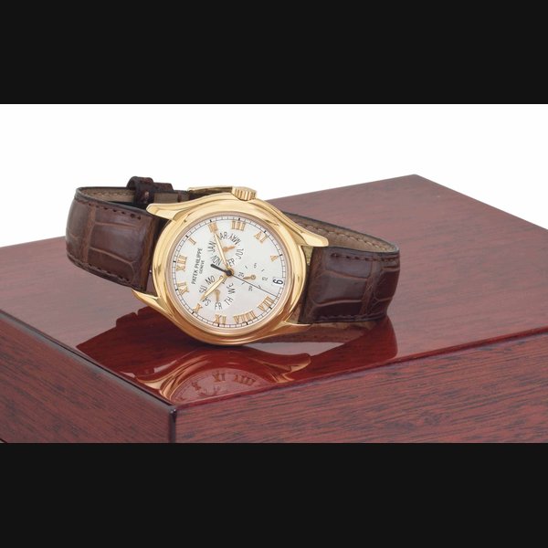 Patek Philippe. An 18k Pink Gold Automatic Annual Calendar Wristwatch with Center Seconds, Original Certificate and Presentation Box SIGNED PATEK PHILIPPE, GENEVE, REF. 5035R, MOVEMENT NO. 3'058'490, CASE NO. 4'033'221, MANUFACTURED IN 1998