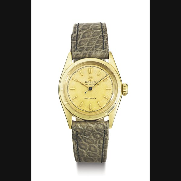 ROLEX. A 10K GOLD WRISTWATCH WITH CENTER SECONDS SIGNED ROLEX, OYSTER SPEEDKING, CASE NO. 840285, REF. 6021, CIRCA 1950