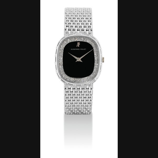 Audemars Piguet AUDEMARS PIGUET. AN 18K WHITE GOLD AND DIAMOND-SET CUSHION-SHAPED BRACELET WATCH WITH ONYX DIAL SIGNED AUDEMARS PIGUET, MOVEMENT NO. 290'257, CASE NO. C8459, CIRCA 1980