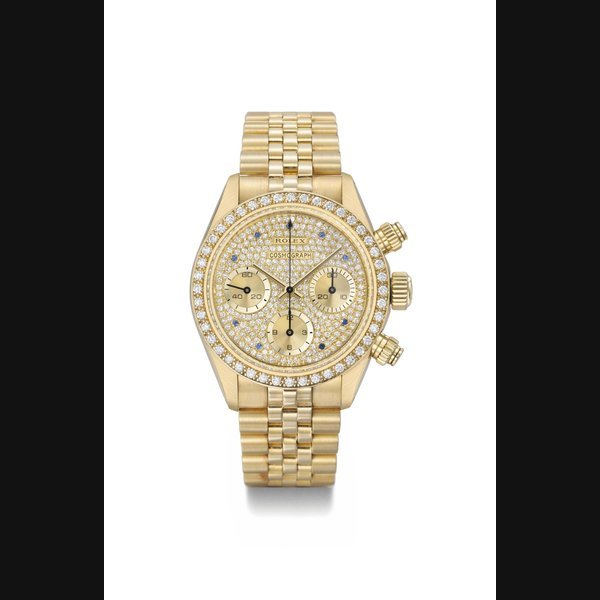 Rolex Rolex. An extremely rare and very attractive 18K gold, diamond and sapphire-set chronograph wristwatch with bracelet, original guarantee and box SIGNED ROLEX, COSMOGRAPH, REF. 6269, CASE NO. 9'676'144, MANUFACTURED IN 1986