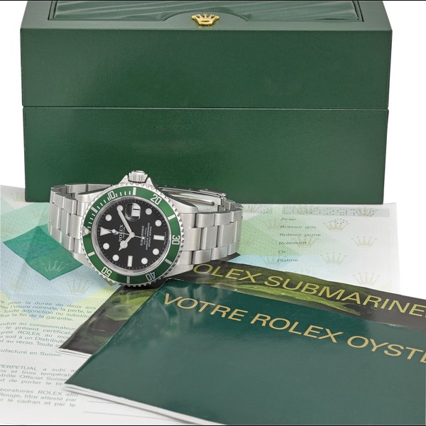 ROLEX. A RARE STAINLESS STEEL AUTOMATIC WRISTWATCH WITH SWEEP CENTRE SECONDS, DATE, BRACELET, ORIGINAL GUARANTEE AND BOX Signed Rolex, Oyster Perpetual Date, Submariner, 1000ft = 300m, ref. 16610LV, case no. D082973, circa 2005