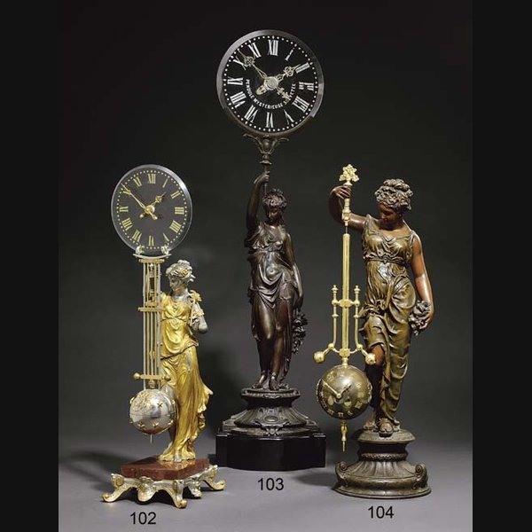 A French spelter and glass figural mystery timepiece E. ROSSET. CIRCA 1890