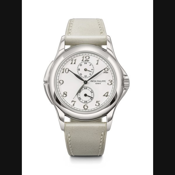 Patek Philippe PATEK PHILIPPE. AN ATTRACTIVE 18K WHITE GOLD DUAL TIME WRISTWATCH WITH 24-HOUR INDICATION AND BREGUET NUMERALS CALATRAVA TRAVEL TIME MODEL, REF. 5134G-001, MOVEMENT NO. 3'083'845, CASE NO. 4'159'071, CIRCA 2001