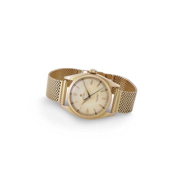 ROLEX. A RARE 18K PINK GOLD AUTOMATIC WRISTWATCH WITH CENTER SECONDS, HONEYCOMB DIAL AND BRACELET SIGNED ROLEX, MOVEMENT NO. F10015, CASE NO. 716250, REF. 6088, CIRCA 1964
