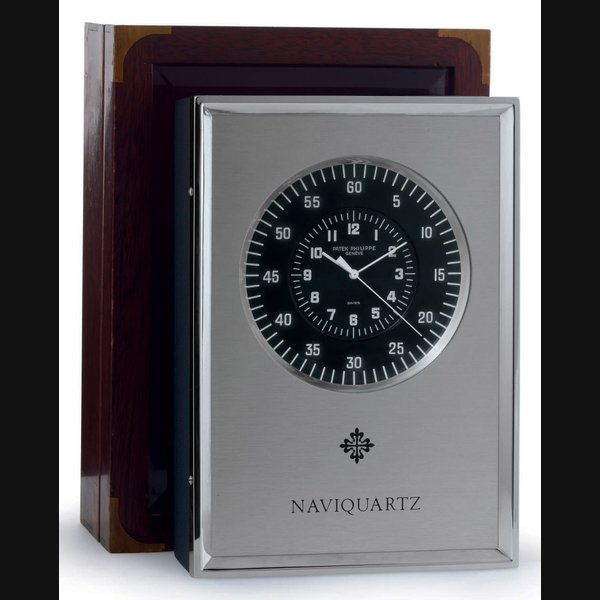 Patek Philippe PATEK PHILIPPE. AN ALUMINIUM ELECTRONIC DESK CLOCK WITH CENTER SECONDS SIGNED PATEK PHILIPPE, GENEVE, NAVIQUARTZ, NO. 690815, REF. E1202, MANUFACTURED IN 1970, Price & Market Data