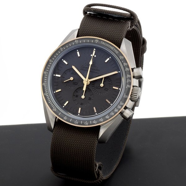 Omega Omega. A titanium and 18K rose gold manual wind chronograph wristwatch Speedmaster Apollo 11 45th Anniversary Limited Edition, Ref:31162423006001, No.1933/1969, Case & Movement No.77812741, Sold 15th July 2014 · 31162423006001