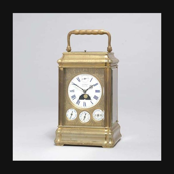 A French giant brass carriage clock with full calendar, moonphase, alarm and subsidiary seconds RETAILED BY E & E. EMANUEL, PORTSEA & PARIS. CIRCA 1870